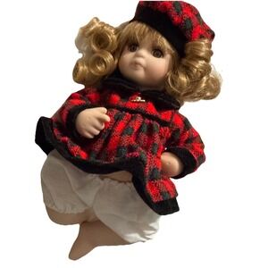 "Carlie" porcelain doll, an 8"Collectible by Show-Stoppers Curly Hair Brown Eyes